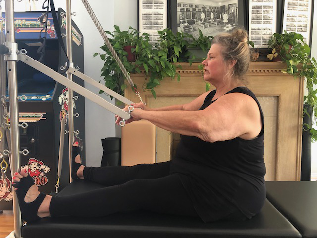 Linda Arroz practicing pilates